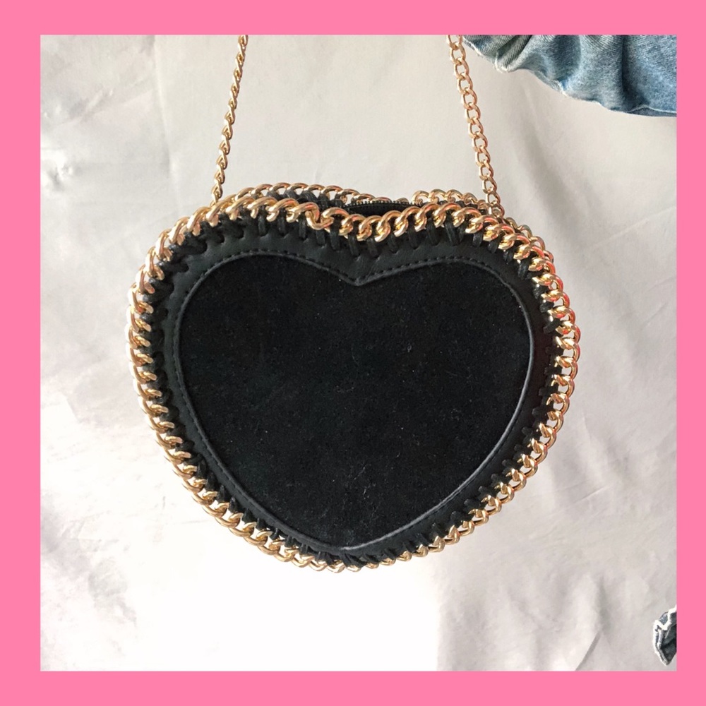 Black heart shaped, suede bag with gold chain trim